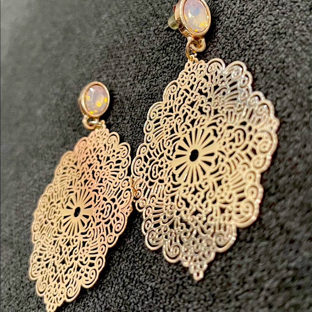 Gold colored intricate design earrings